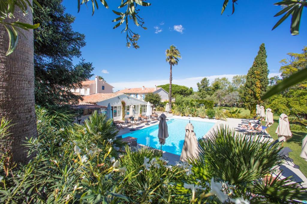 Pool hidden behind the verdant plants in a provencal garden