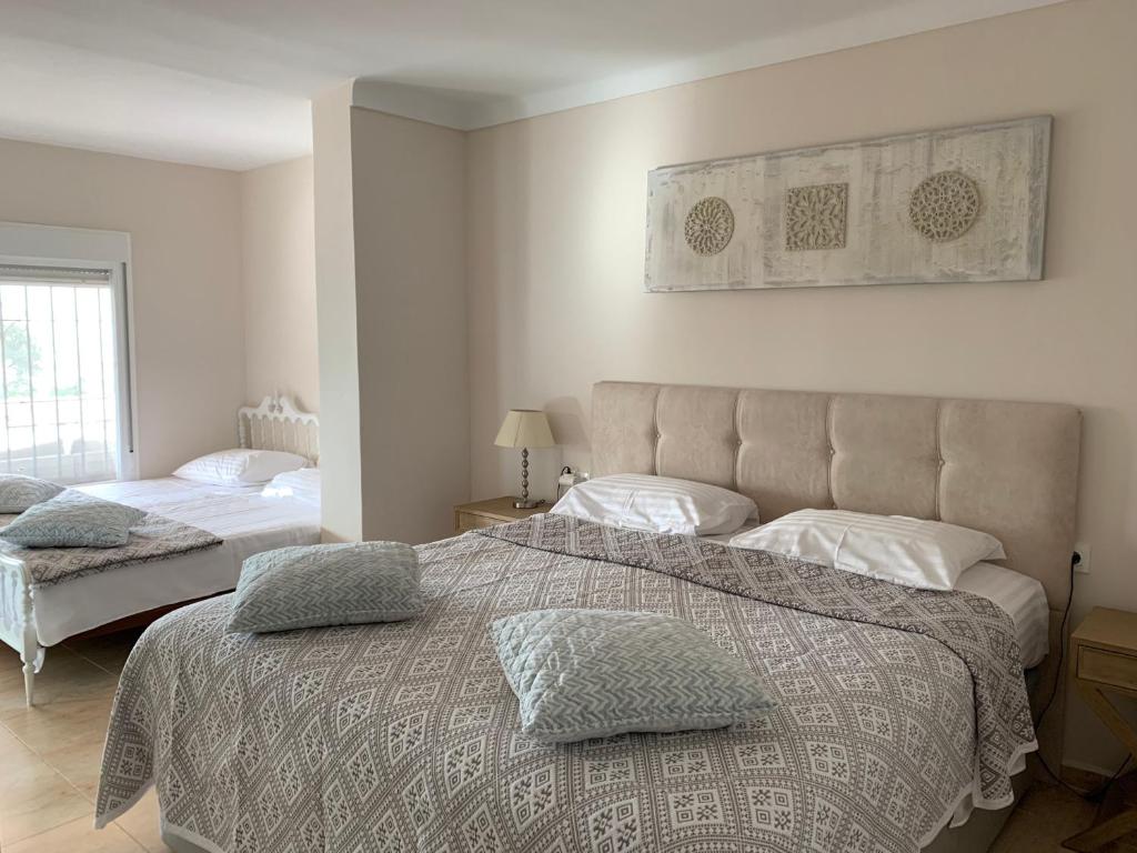 Cama o camas de una habitación en Apartamentai