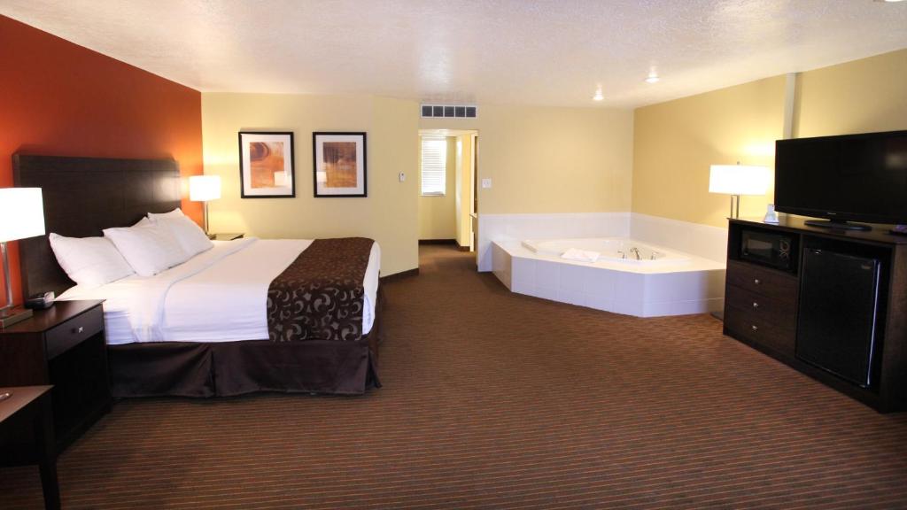 A superior king room with a whirlpool tub at the Baymont by Wyndham Cedar City.