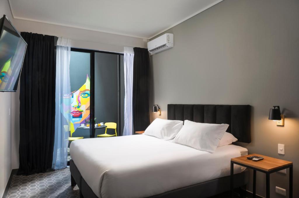 Cama o camas de una habitación en The PopCity Hotel