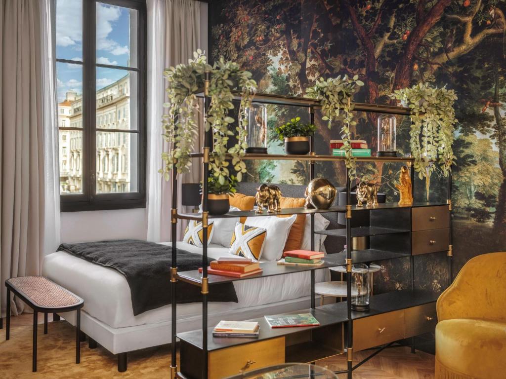 Hotel room adorned with potted plants