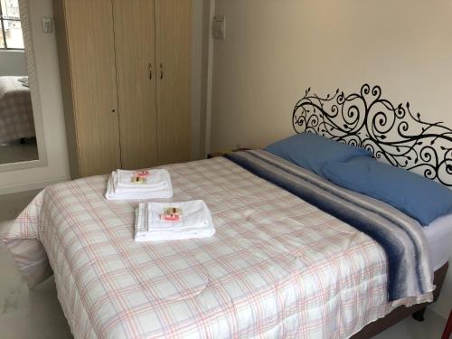 Cama o camas de una habitación en Sweet Home Porto Alegre