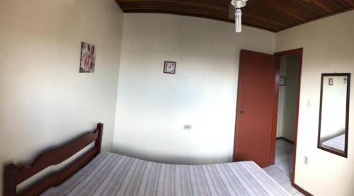 A bed or beds in a room at Residencial Souza - Praia da Pinheira - SC