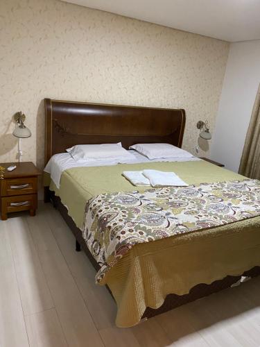 Cama o camas de una habitación en Apartamento em Gramado - Solar da Encosta