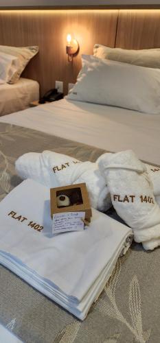 Cama o camas de una habitación en Flat Maravilhoso na praia - Ilusion Hotel