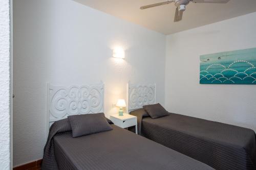 Cama o camas de una habitación en Zodiac Apartments