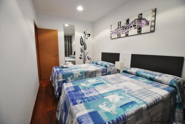 Cama o camas de una habitación en Apartamentos Hemar Granada
