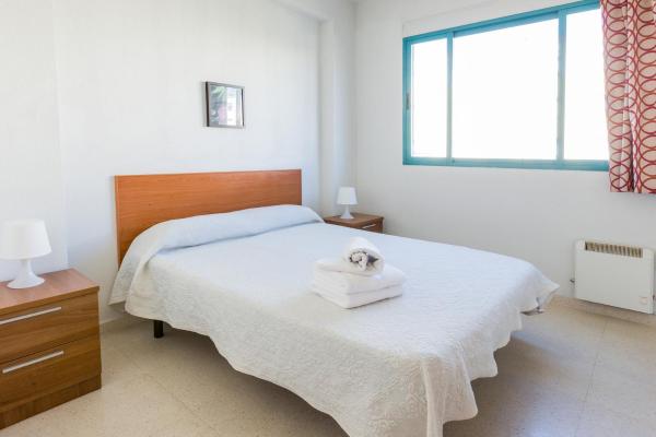 Cama o camas de una habitación en Apartamentos Fernando de los Rios