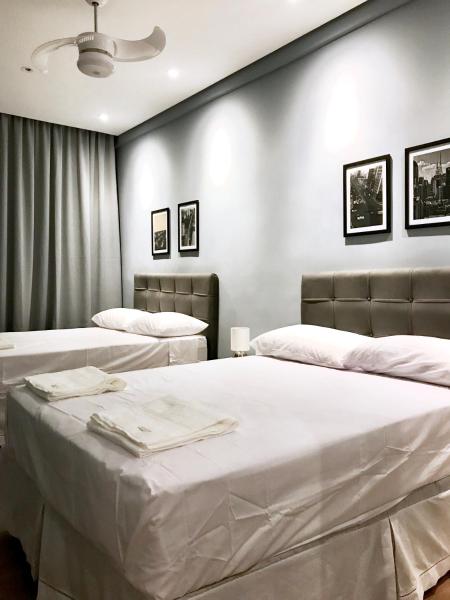 Cama o camas en una habitación de un apartamento de hotel estándar en la Avenida Paulista