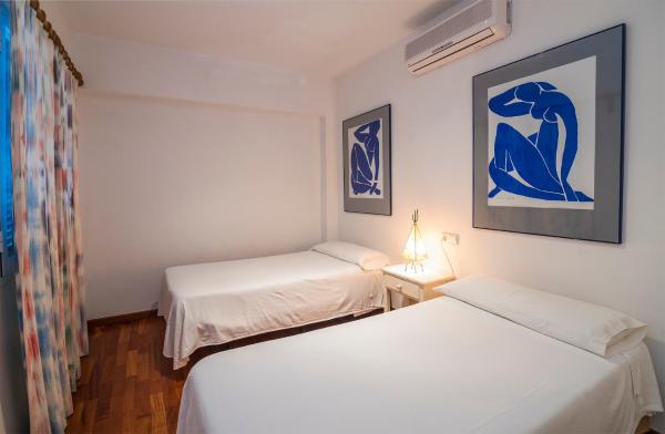 Cama o camas de una habitación en Beachfront apartment Tanamar