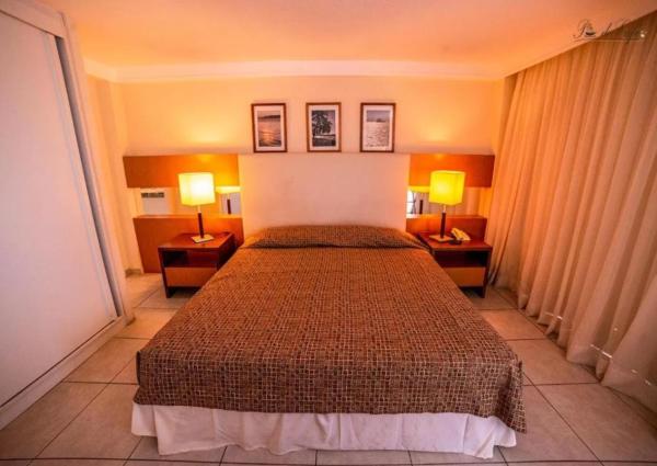 Cama o camas de una habitación en Conforto em Ponta Negra Natal