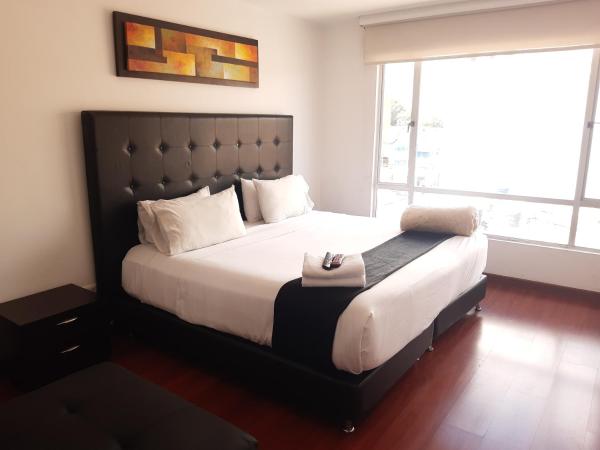 Cama o camas de una habitación en Apartasuites Plaza Modelia