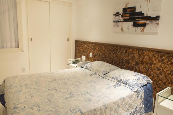 Cama o camas de una habitación en Flat Natal - Localização TOP e WIFI
