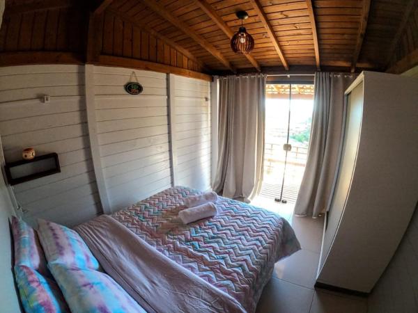 A bed or beds in a room at Terima Kasih Moradas