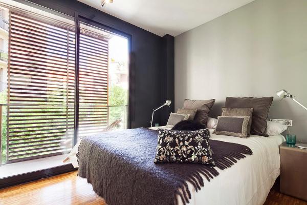 Una habitación en Apartment Barcelona Rentals - Sarria Apartments Near Center